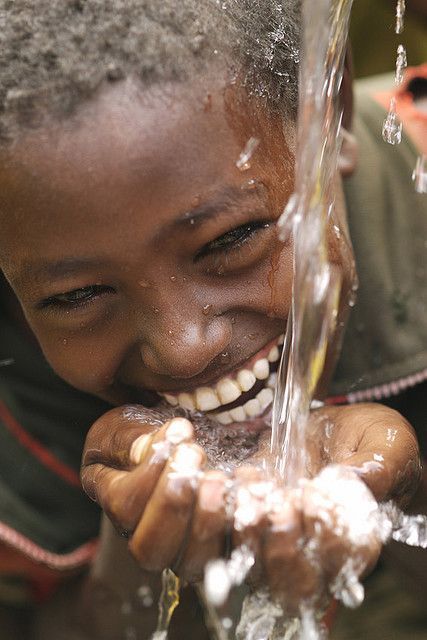 Community celebrating clean water access.